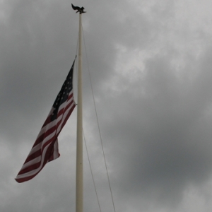 Cloudy day taking down the flag.