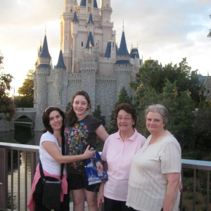 3 generations standing at Cinderella Castle