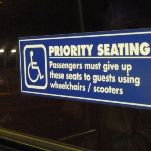 Sign above bus seat