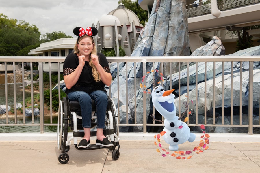 Woman in a wheelchair posing for Magic Shot featuring Olaf